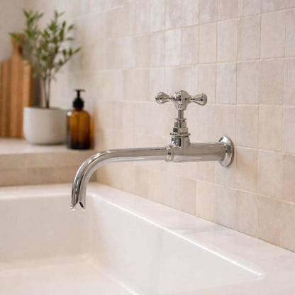 Wall-Mount Polished Nickel Faucet with Cross Handle