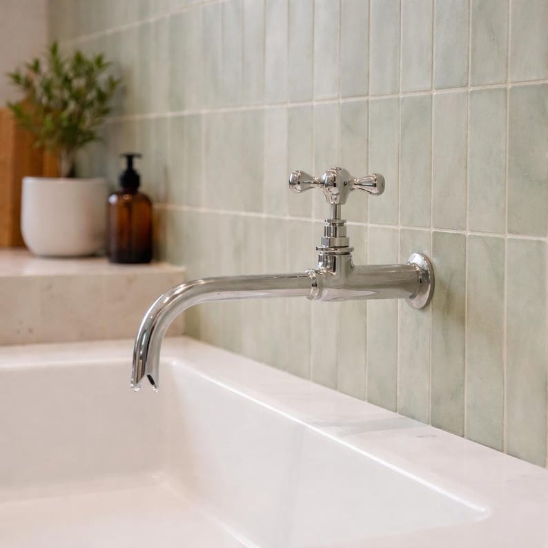 Wall-Mount Polished Nickel Faucet with Cross Handle