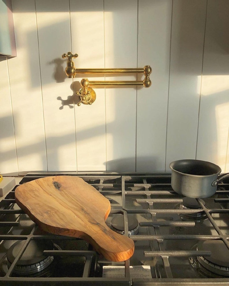 Rustic Wooden Range Hood with Brass Pot Filler